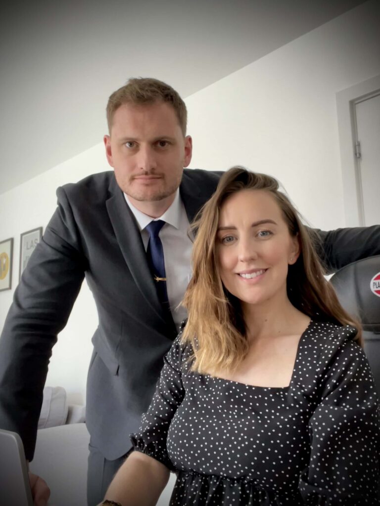 the owners of The Ferry Pilots in their office