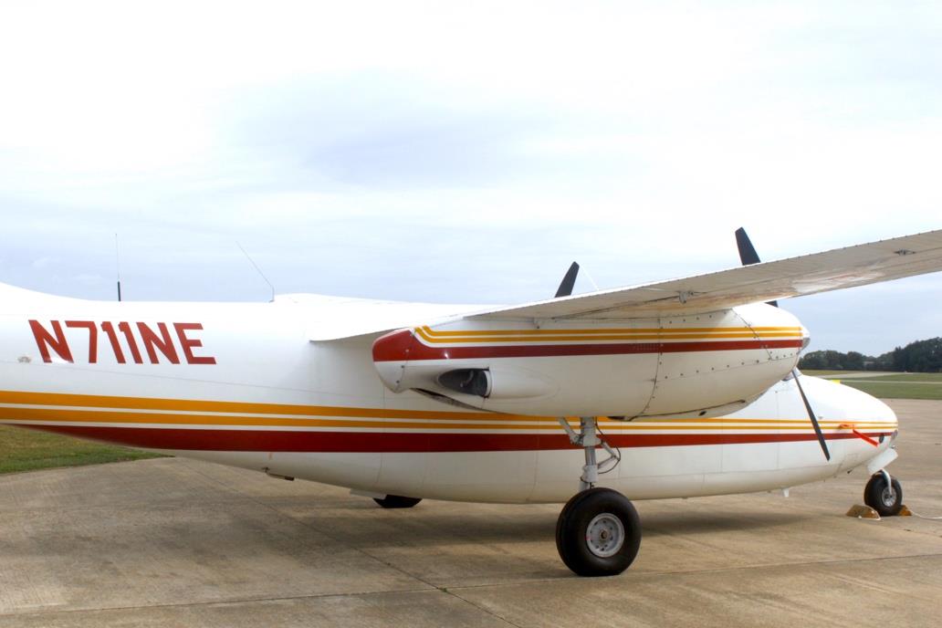 Aero Commander 500 N711NE side view showing tail section and engine nacelles