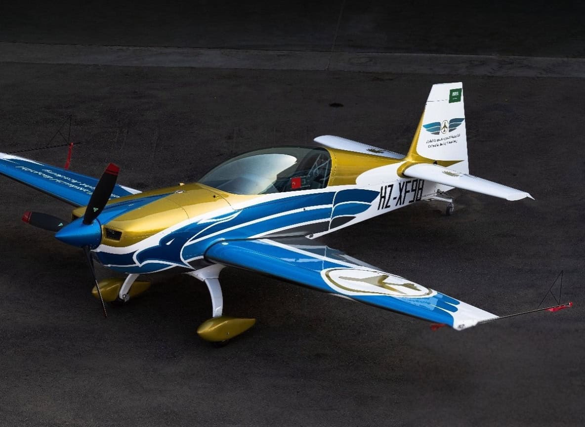 Top view of Extra 330LX HZ-XF98 showing sleek aerobatic design and three-blade propeller