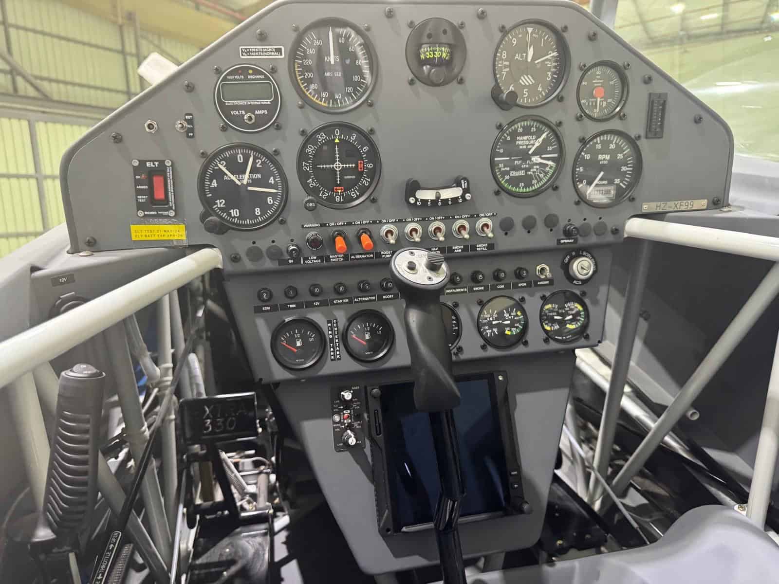 Front cockpit of Extra 330LX HZ-XF99 with flight gauges and central control stick
