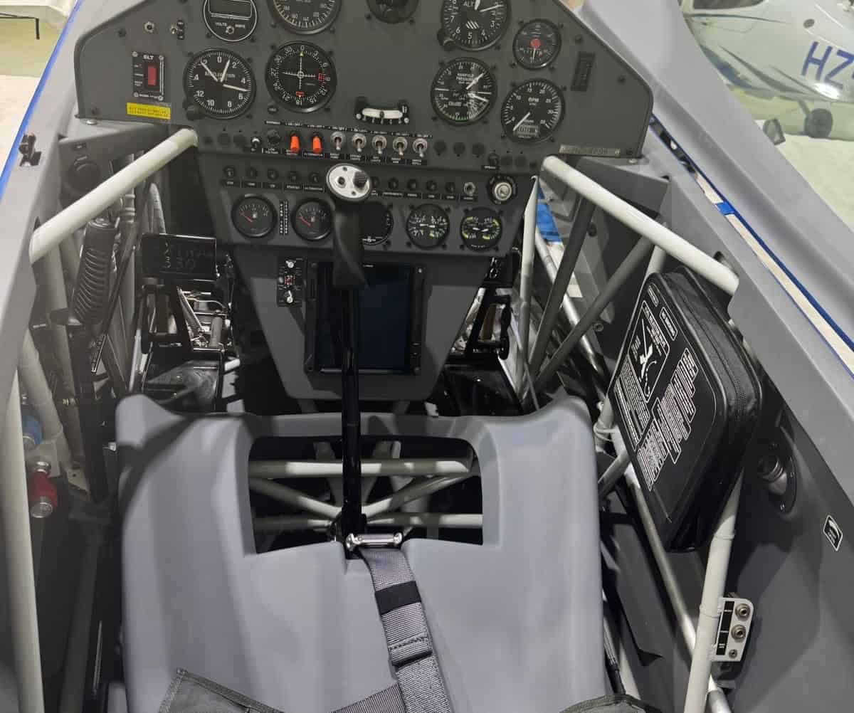 Pilot seat and central control stick with instrument panel of Extra 330LX HZ-XF99