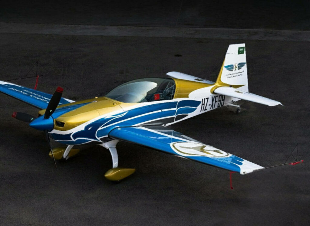 Overhead view of Extra 330LX HZ-XF99 showcasing blue and gold aerobatic paint scheme